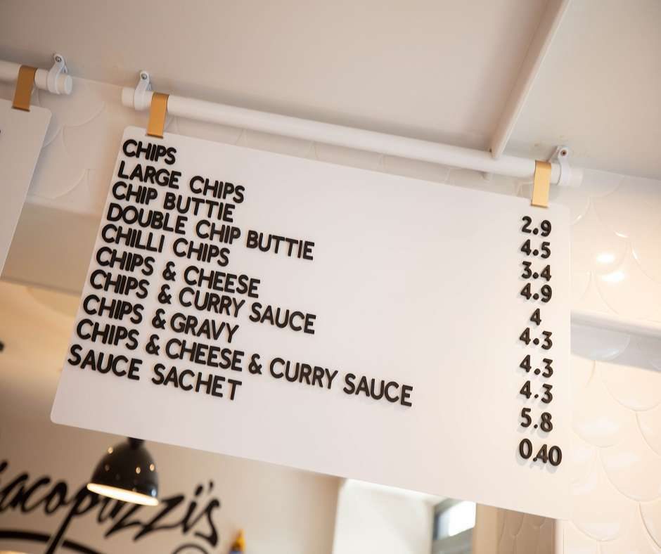 a shop with menu hanging in front of the desk